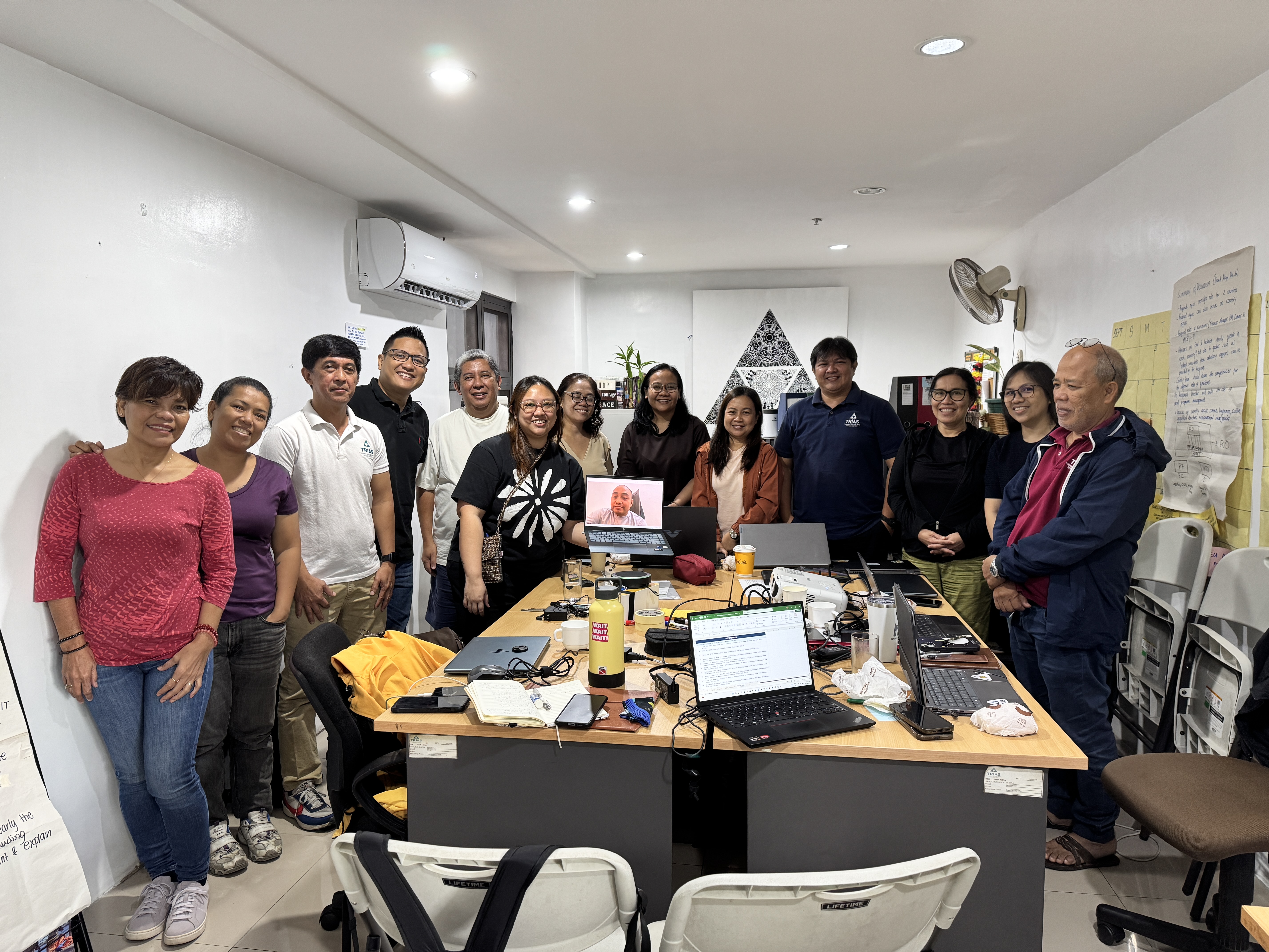 Trias Southeast Asia team at the Kenzo AI for Good AI Clinic, Philippines and Indonesia participants around a working table